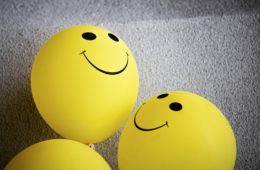 yellow smiley emoji on gray textile